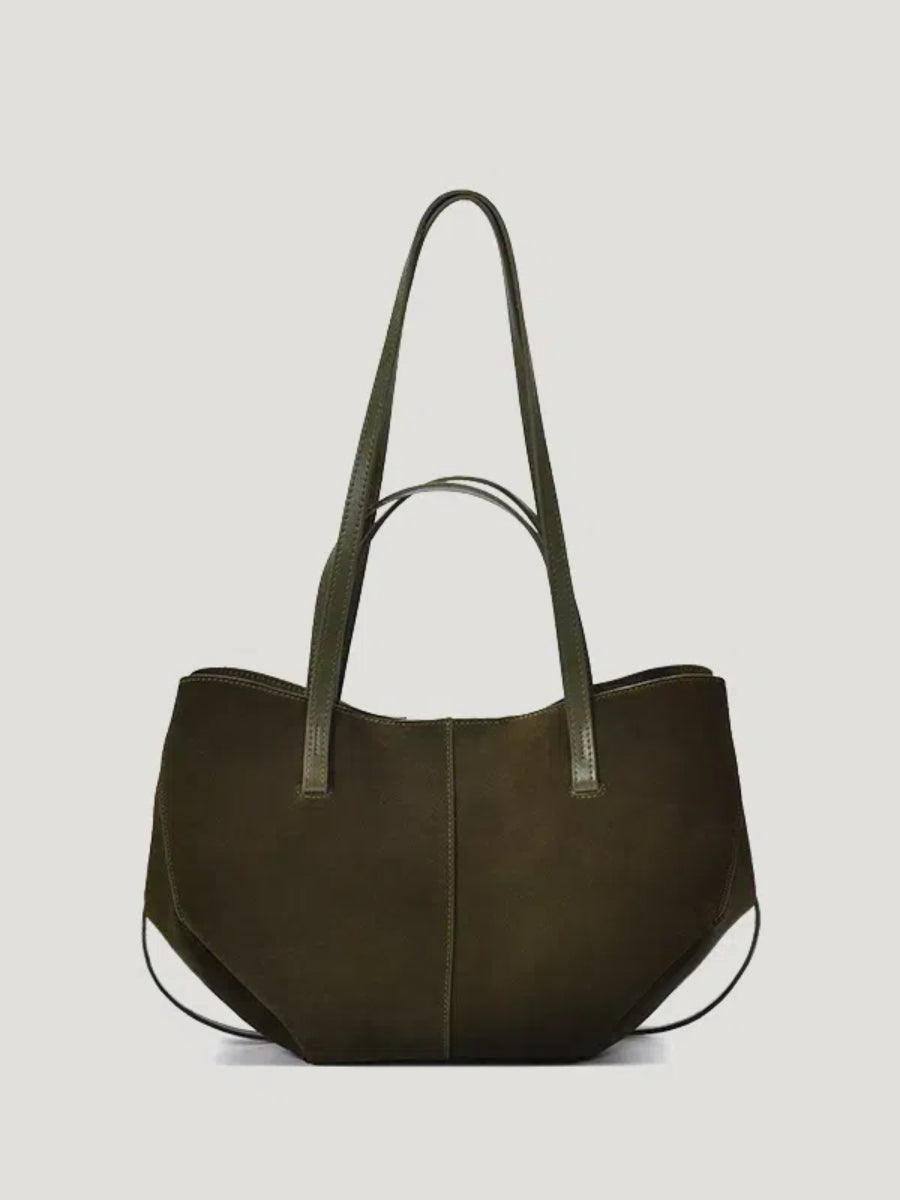 A green hand/shoulder Polene bag, featuring high-quality suede leather and catfish whiskers, set against a white background.